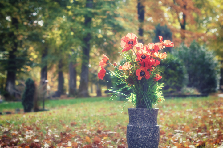 grave flowers in a vase