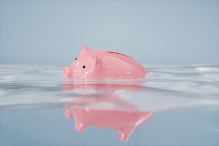 Pig money box floating in water