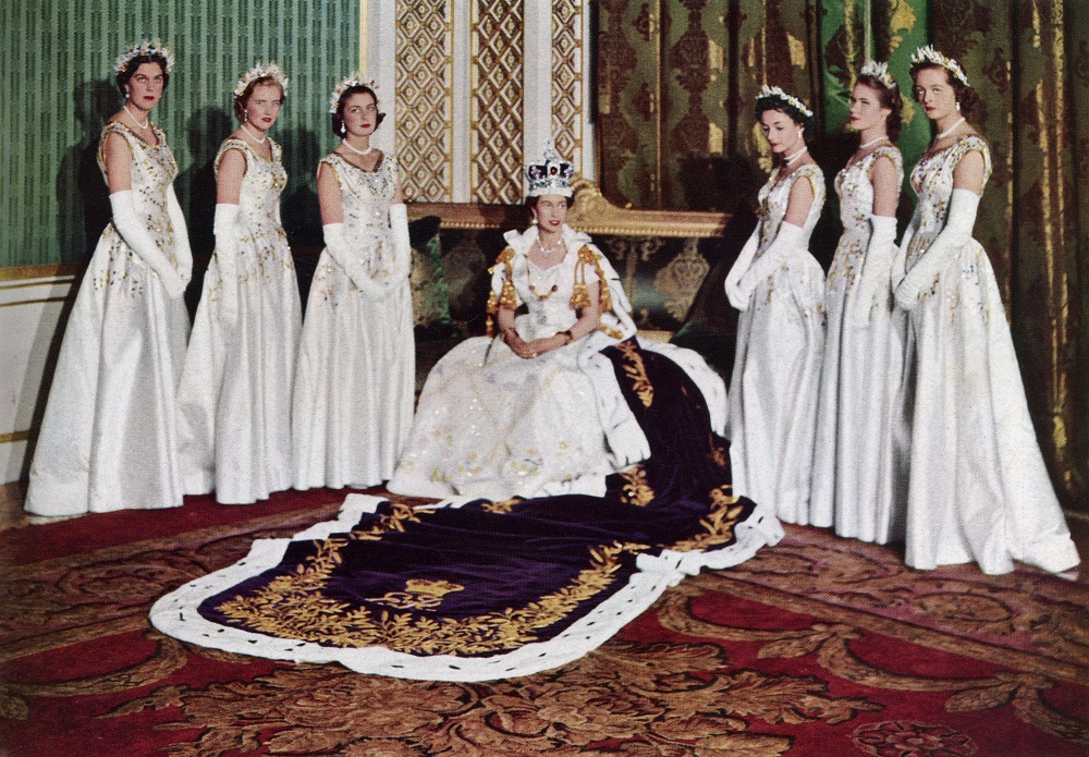 Queen Elizabeth II sitting on a chair on the day of her coronation