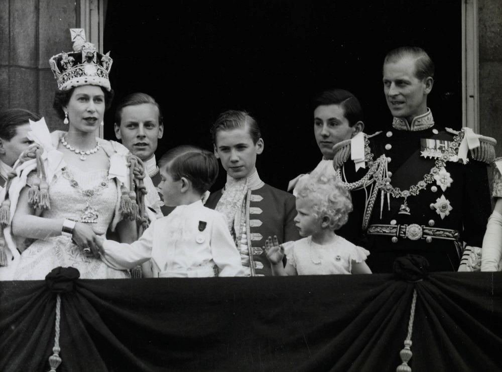 Queen Elizabeth II on the balcony at her coronation, with Prince Philip, Princess Anne and Prince Charles in 1953