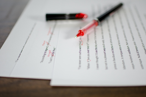 red pen marking through document